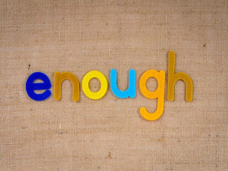 word 'enough' in magnetic letters